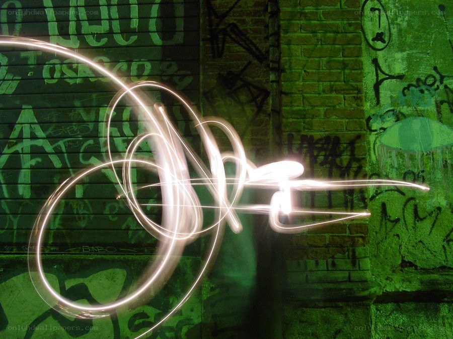 light painting on graffiti wall