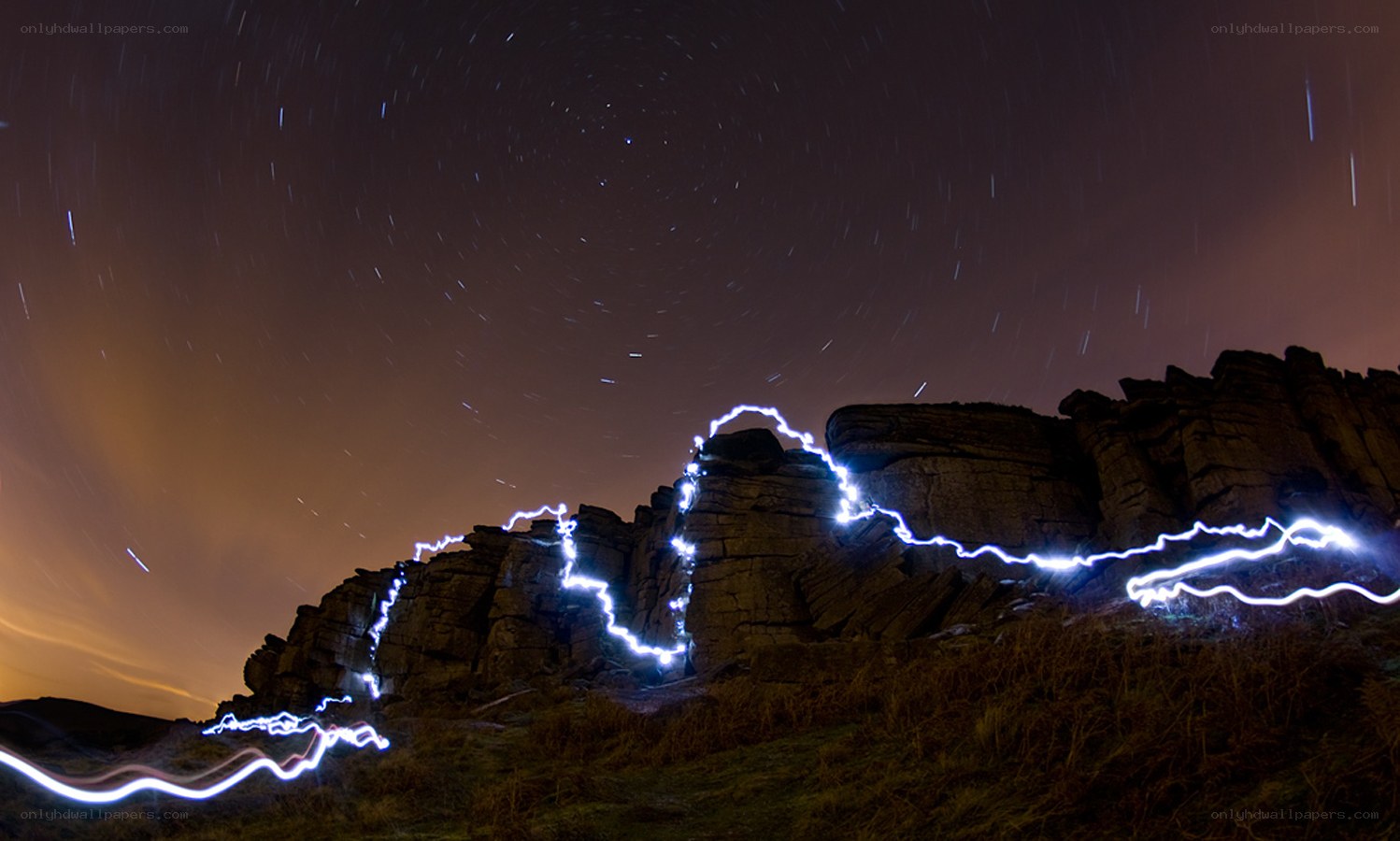 Light painting on rocky cliffs