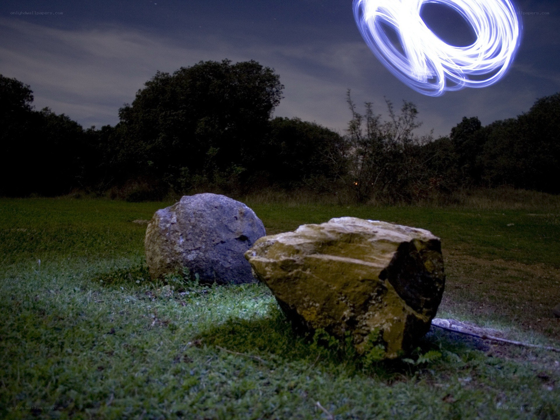 Light painting over rocks at night