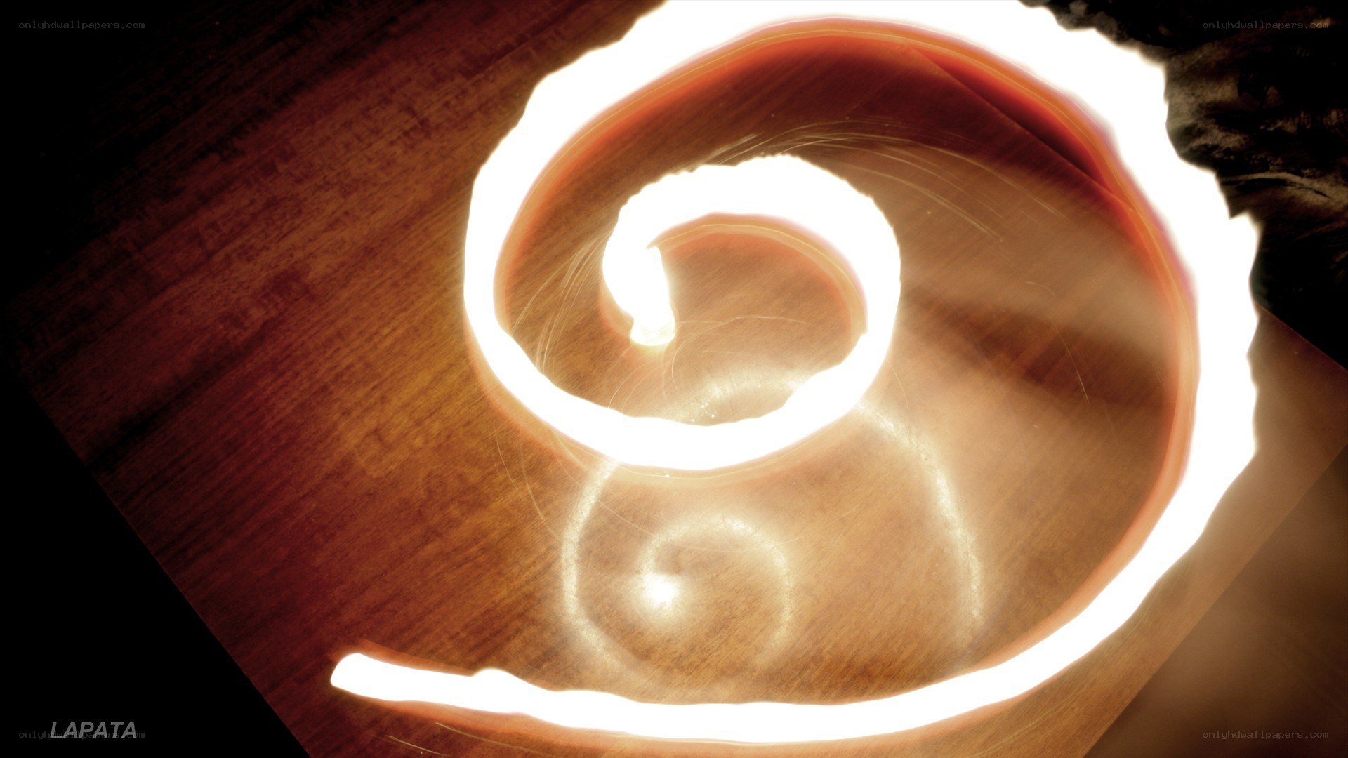 Light spiral on wood