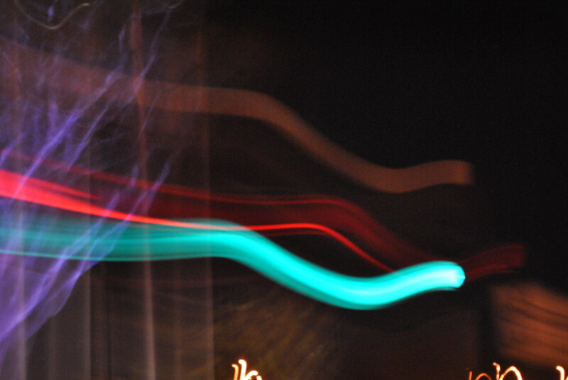 Light Trails in Motion — Cyan