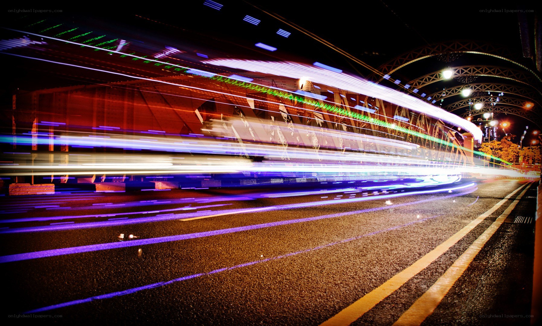 Light trails on a city bridge