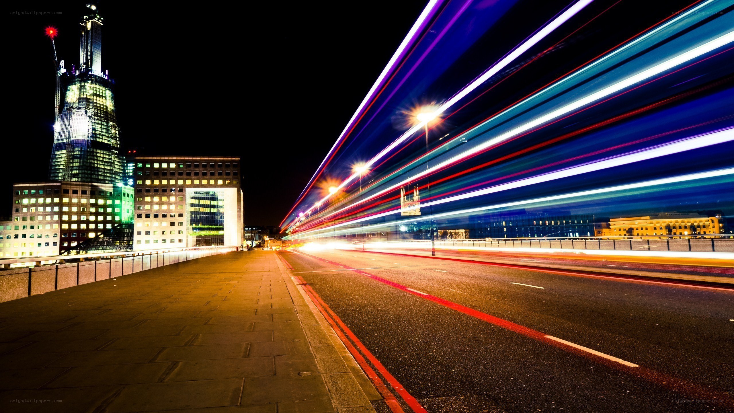 Light trails on a city bridge