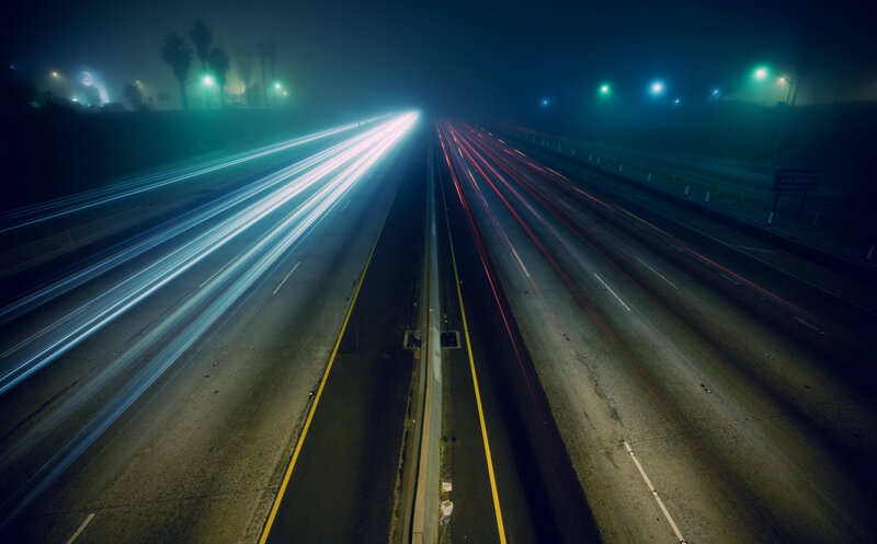 Light trails on a foggy highway