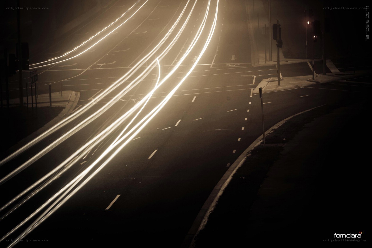 Light trails on a foggy road