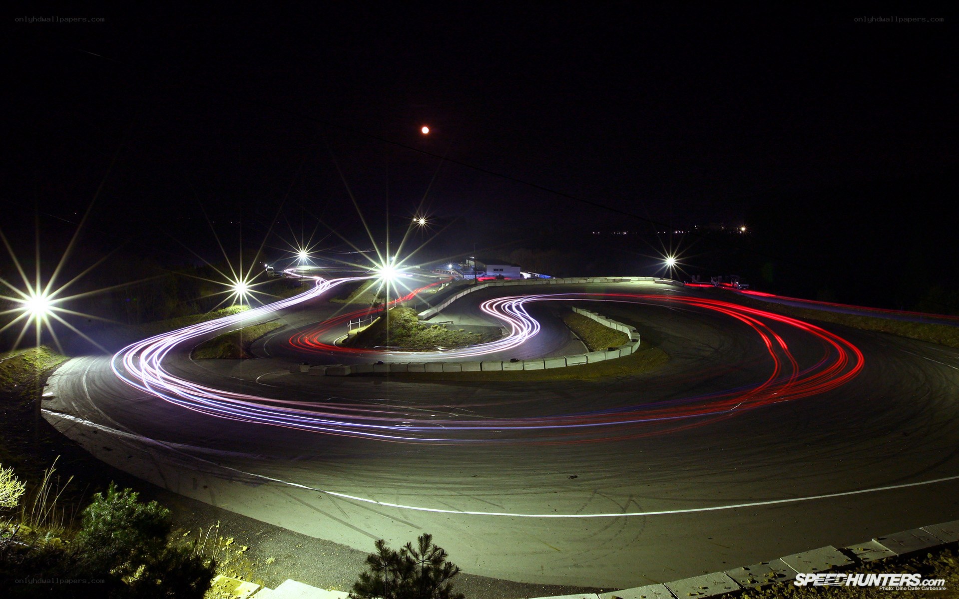 Light trails on a racetrack at night