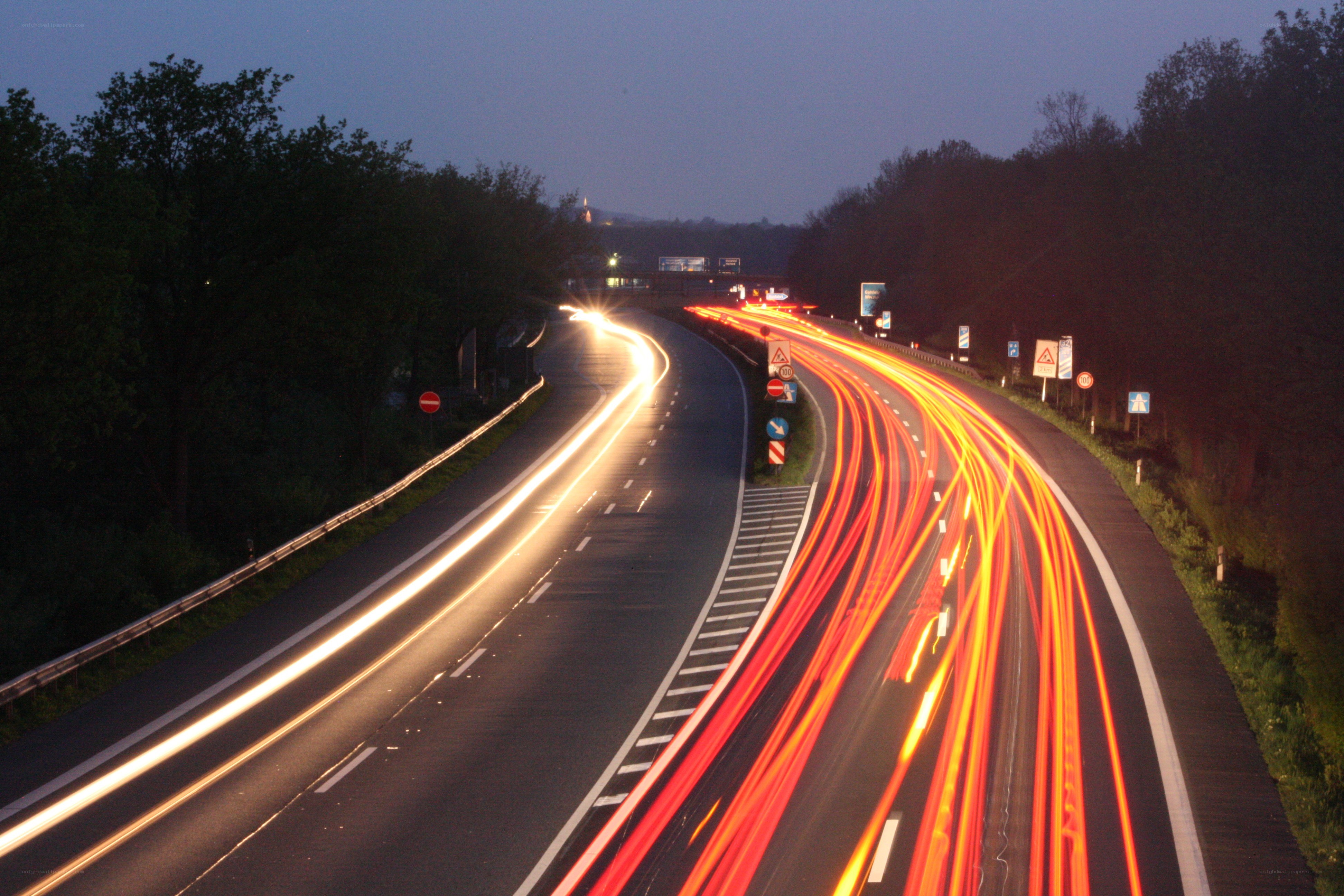Light trails on a winding highway