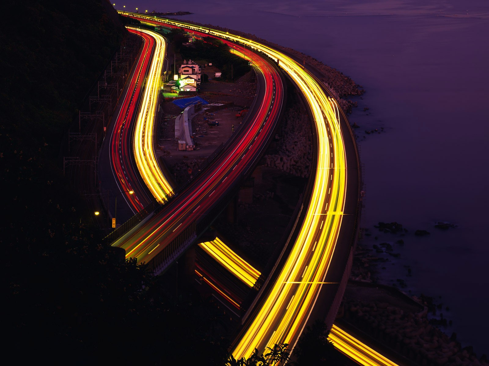 Light trails on coastal highway