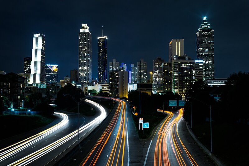 Light Trails on Highway — Black, Dramatic, Night, Photograph, City Skyline, Skyscrapers