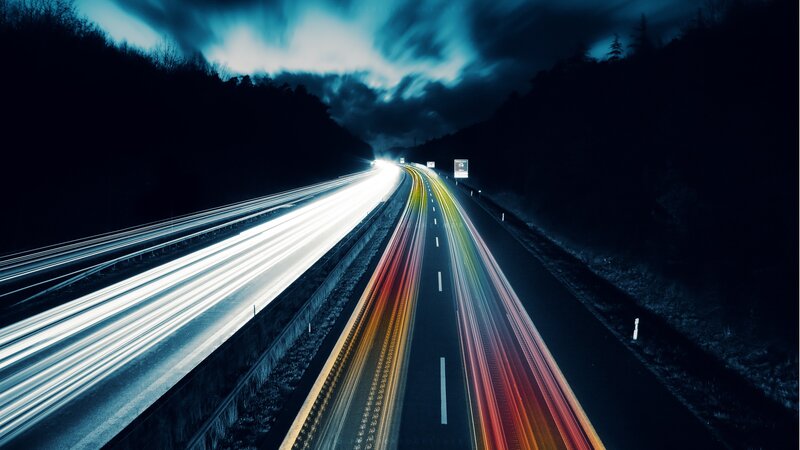Light Trails on Highway — Blue, Dramatic, Night, Photograph, Clouds, Trees, Black