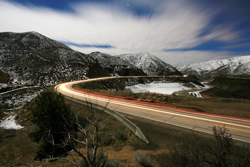 Light trails on winding mountain road