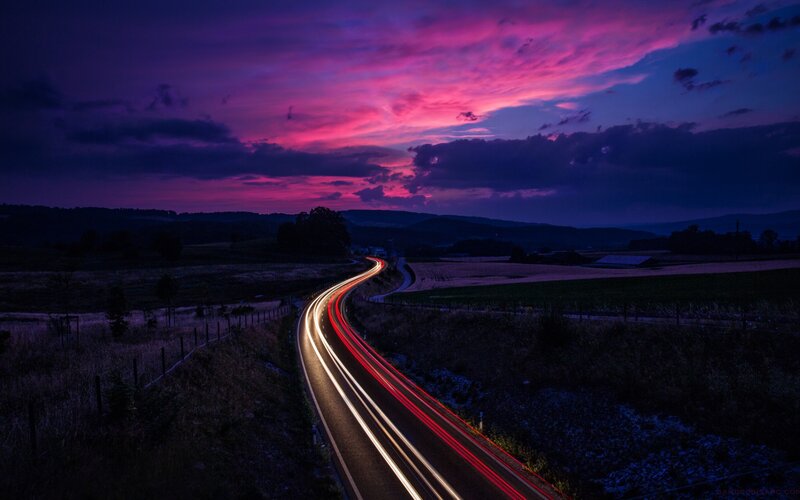 Light Trails on Winding Road — Purple