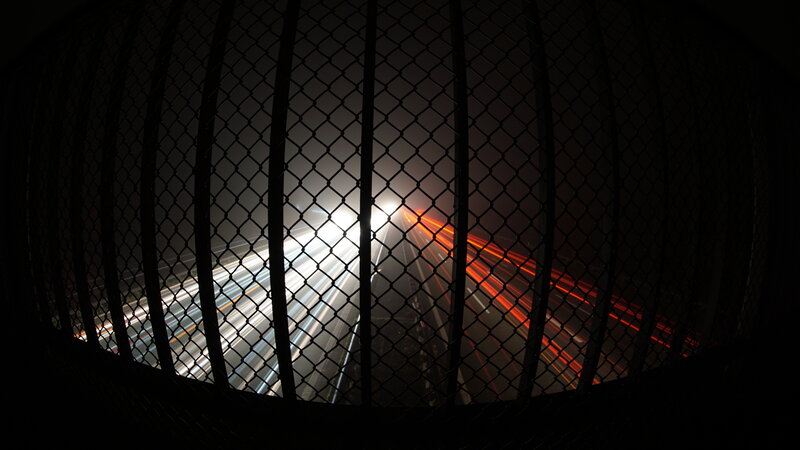 Light Trails Through Fence
