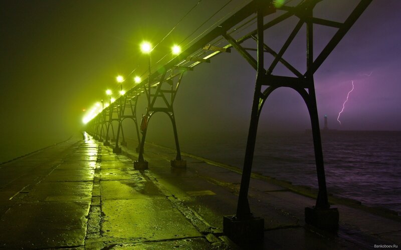 Lighted Pier in Storm