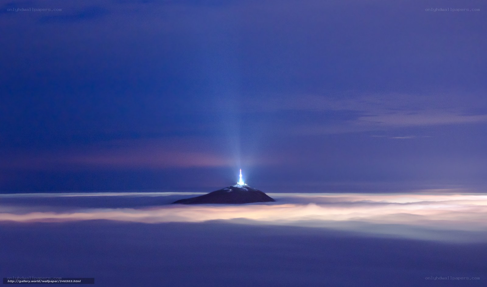 Lighthouse above the clouds
