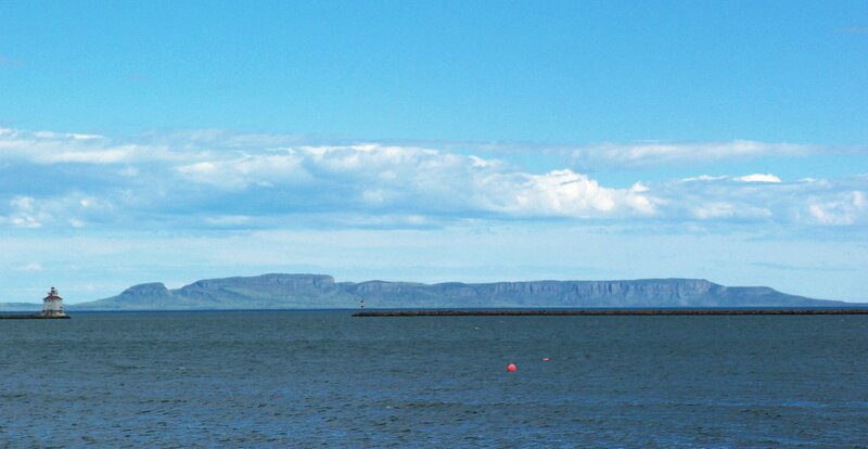 lighthouse and distant mountains