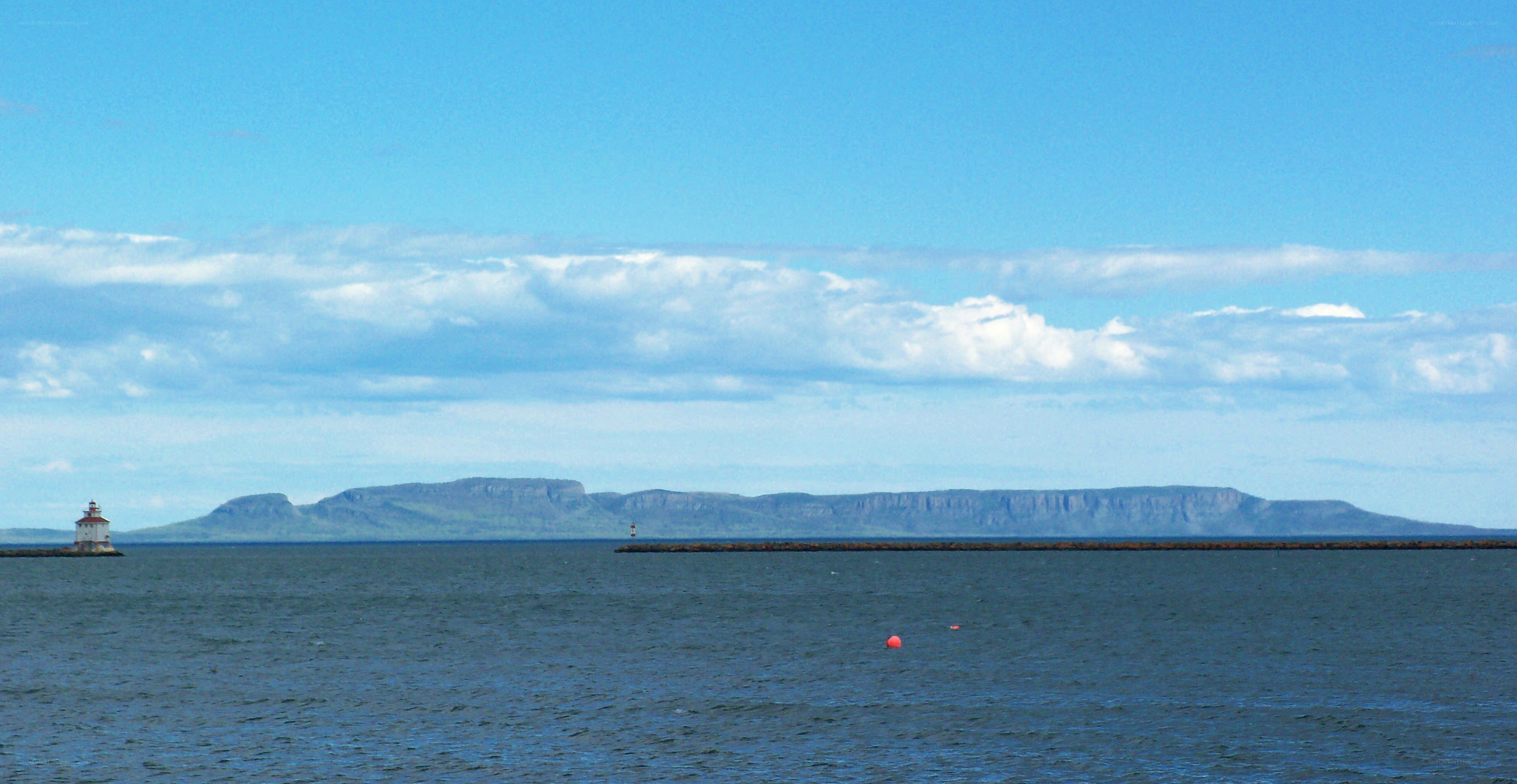 lighthouse and distant mountains