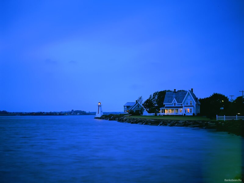 Lighthouse and House at Dusk
