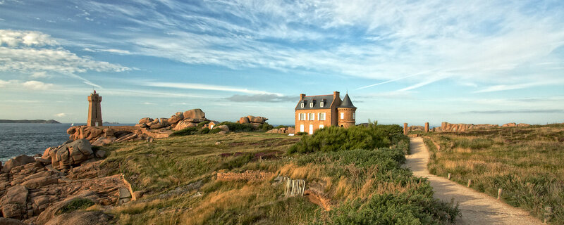Lighthouse and House on Coast — Blue, Serene, Afternoon, Photograph, Sea