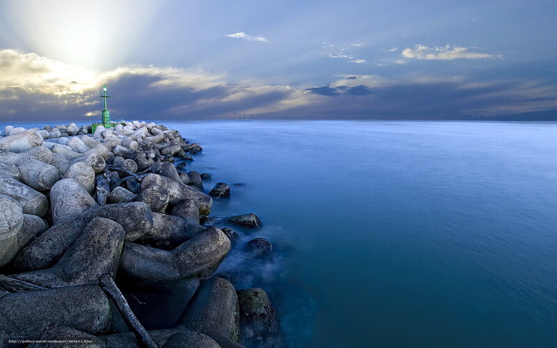 Lighthouse at dawn on a calm sea