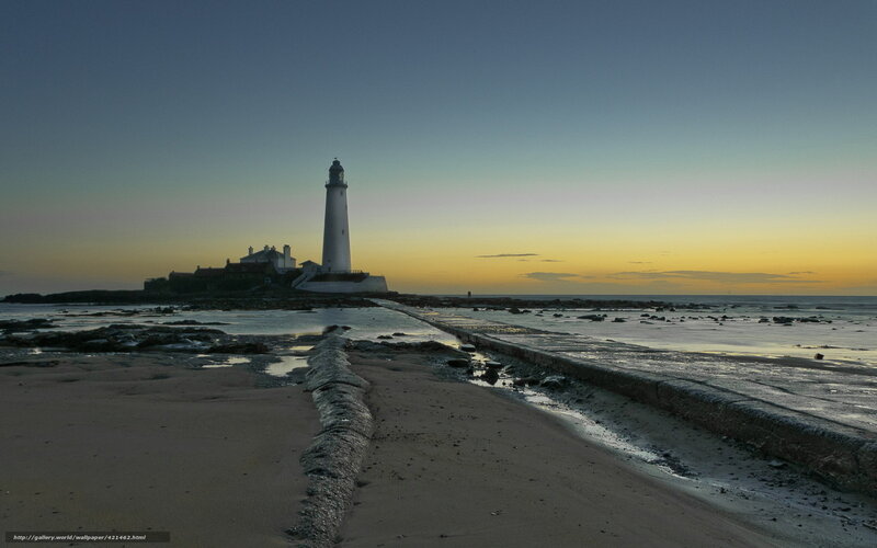 lighthouse at dawn on a rocky shore
