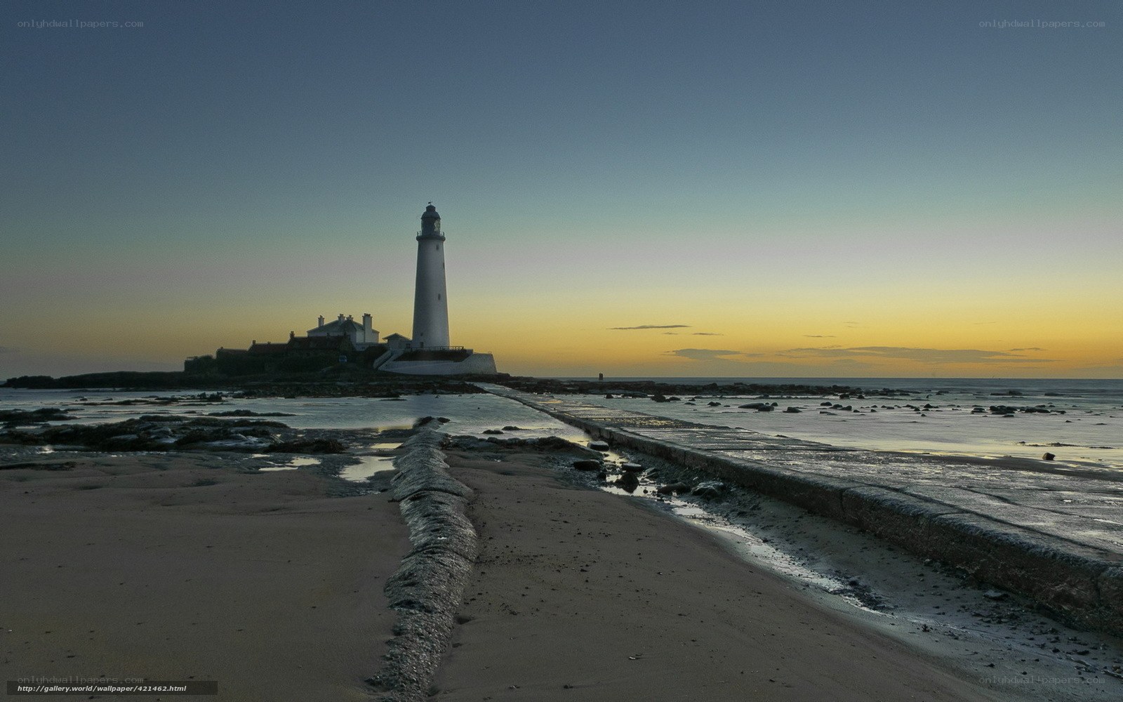 lighthouse at dawn on a rocky shore