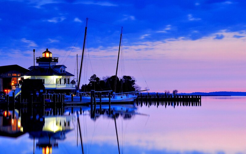 Lighthouse at Dusk — Blue, Serene, Sunset, Photograph, Sailboat