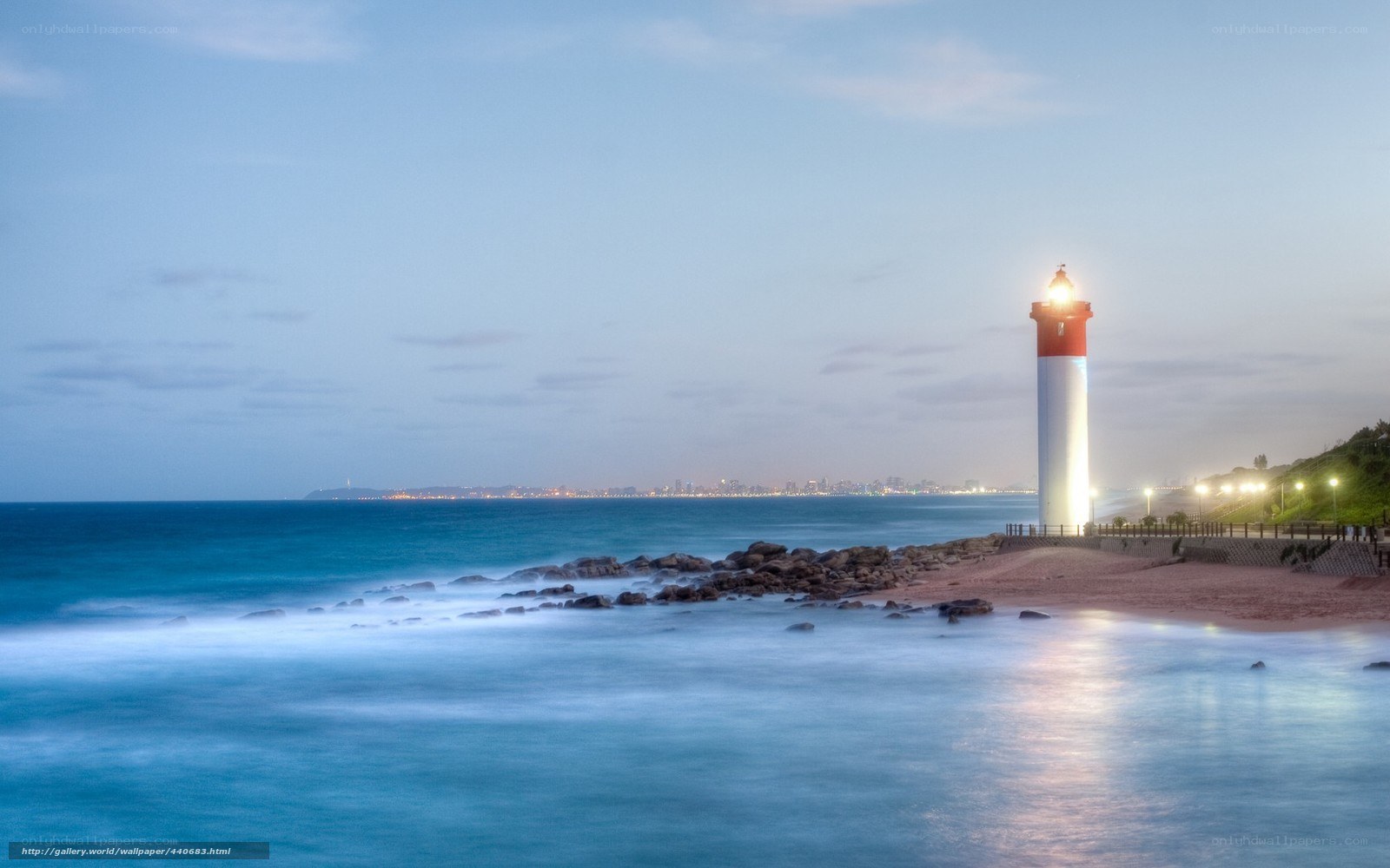 Lighthouse at dusk by the sea