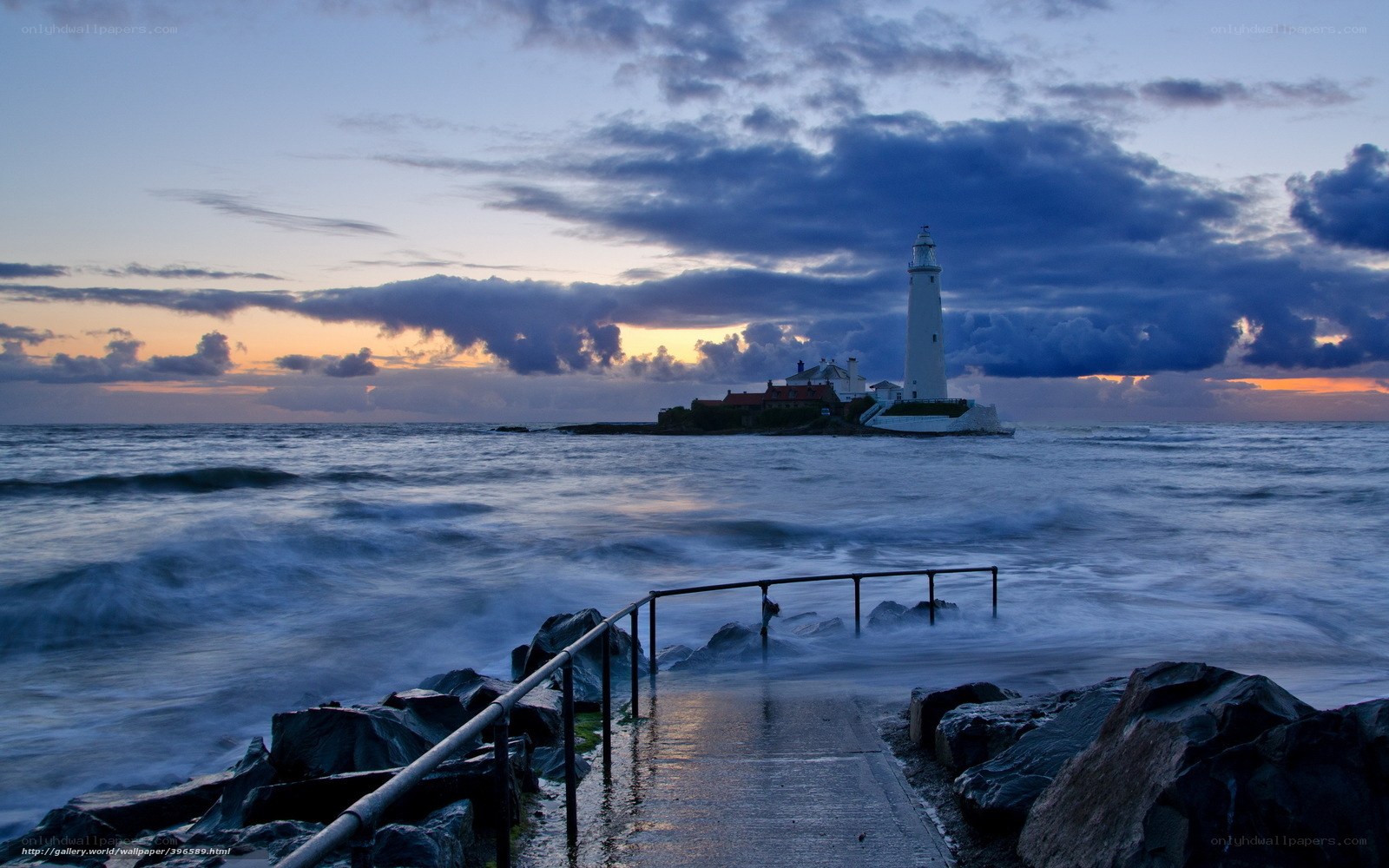 Lighthouse at dusk by the sea