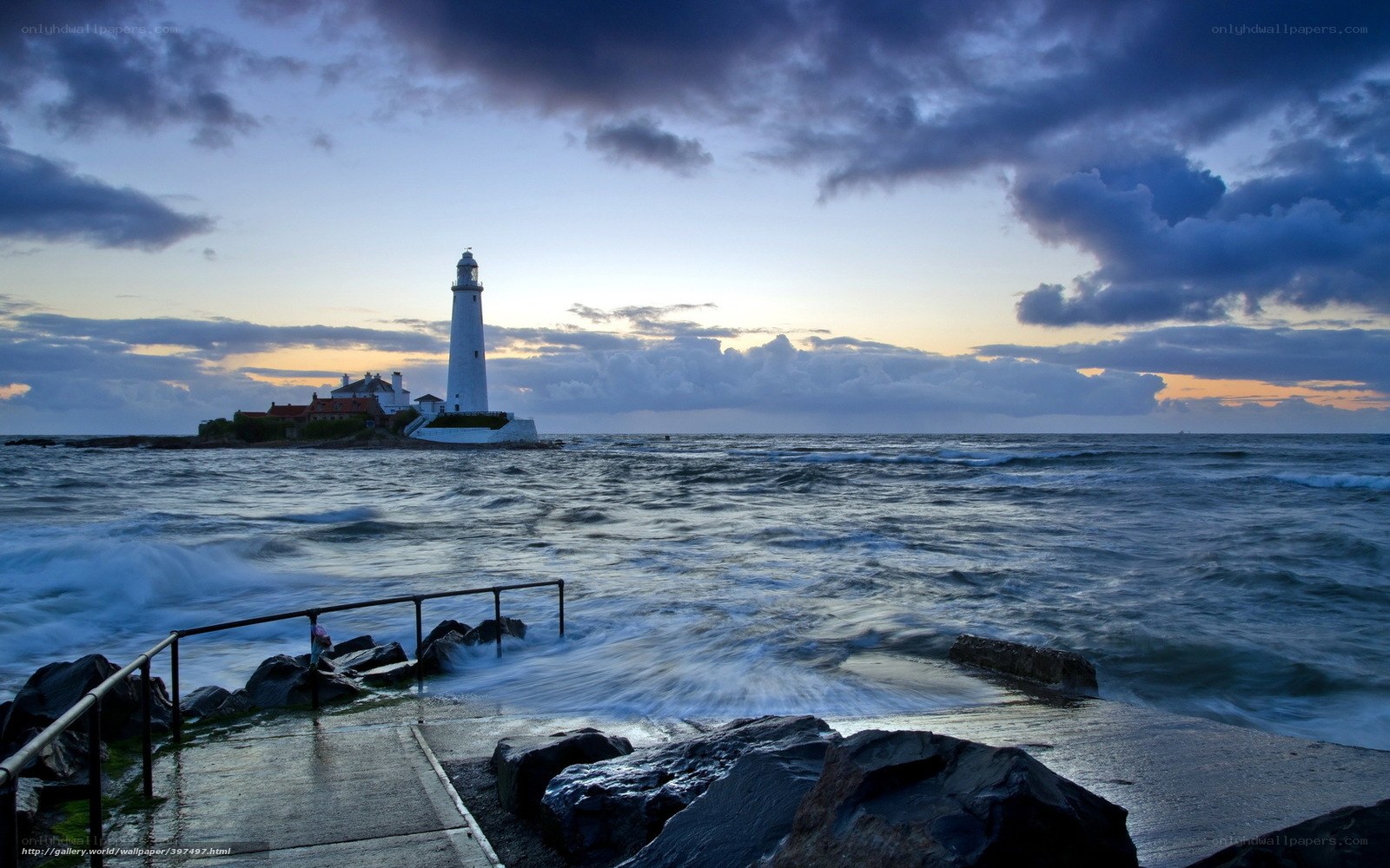 Lighthouse at dusk by the sea