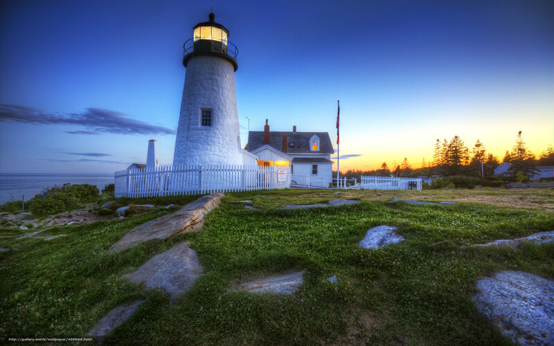 Lighthouse at dusk by the sea