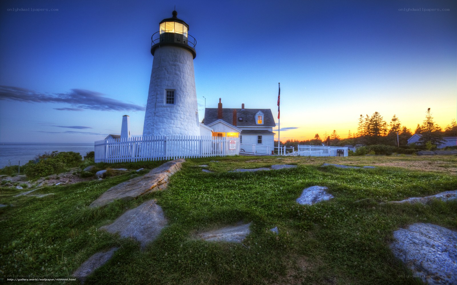 Lighthouse at dusk by the sea