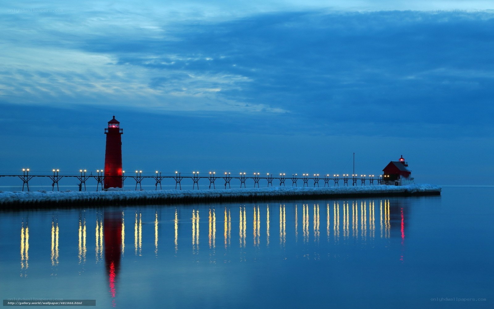Lighthouse at dusk on a calm lake