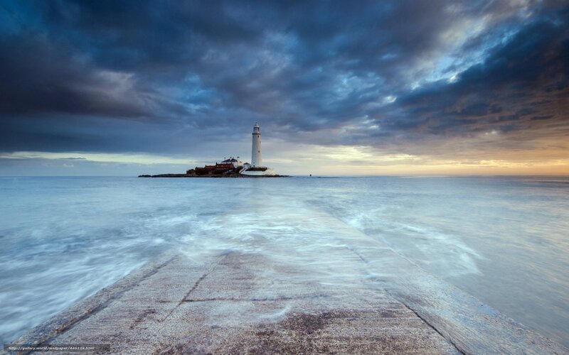 Lighthouse at dusk on a calm sea