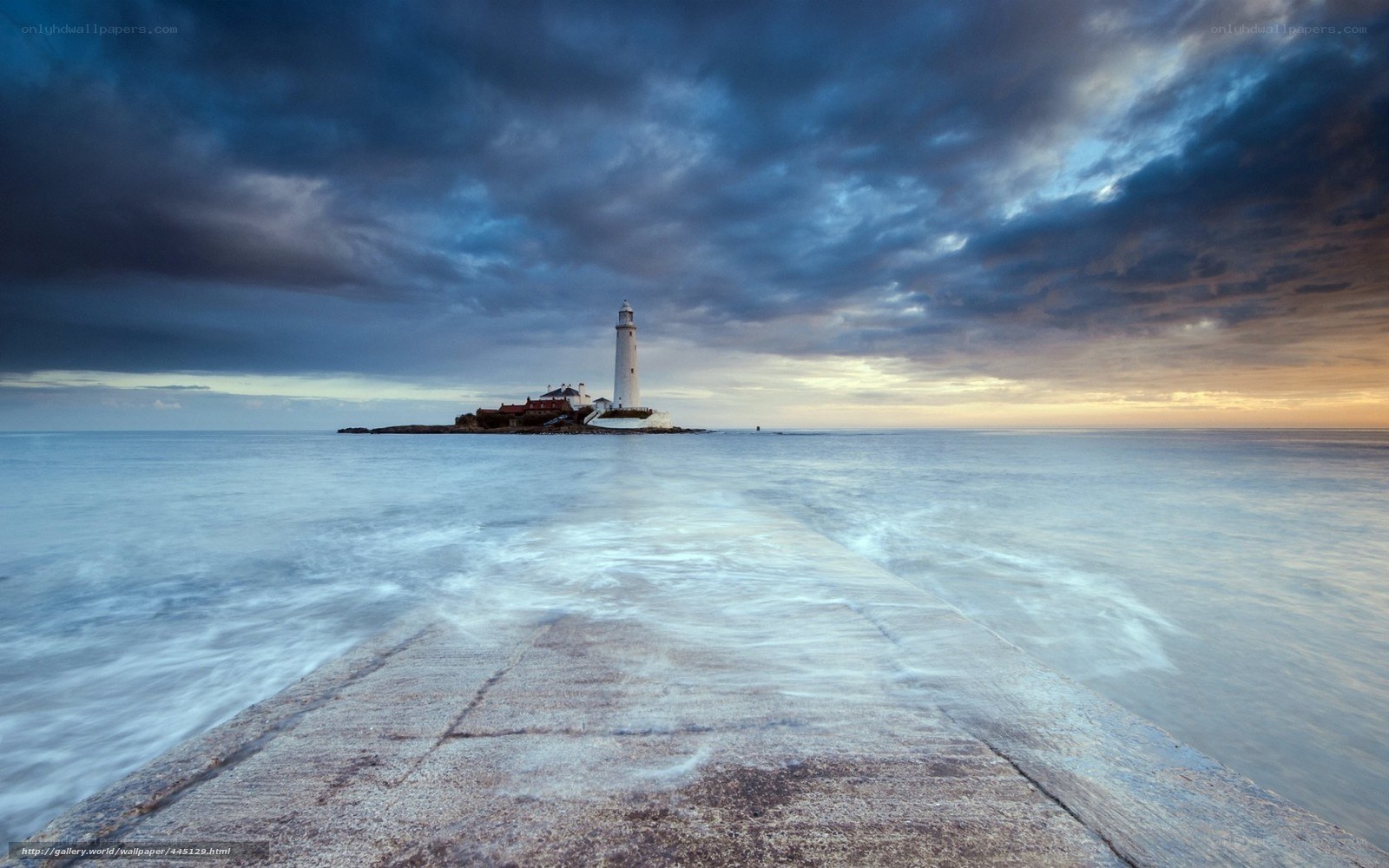 Lighthouse at dusk on a calm sea