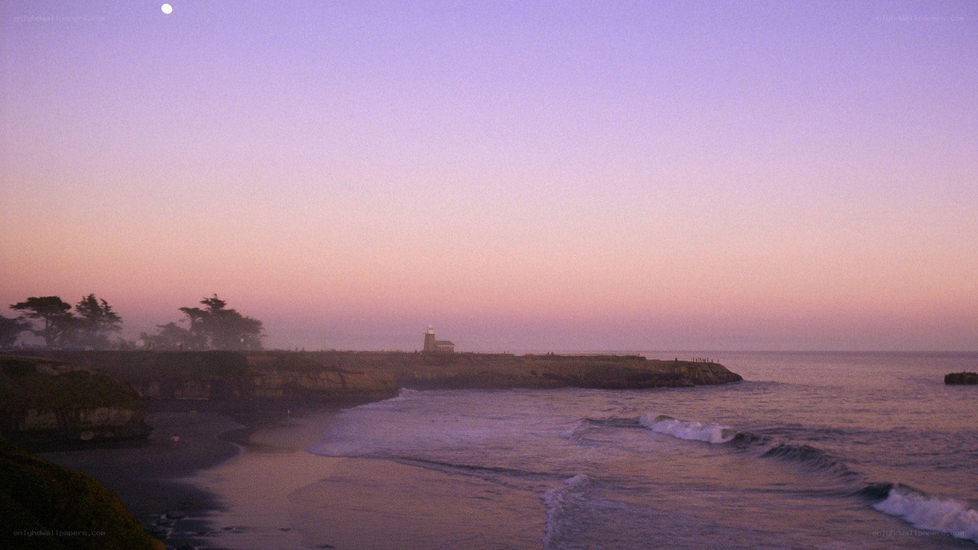 lighthouse at dusk on the coast