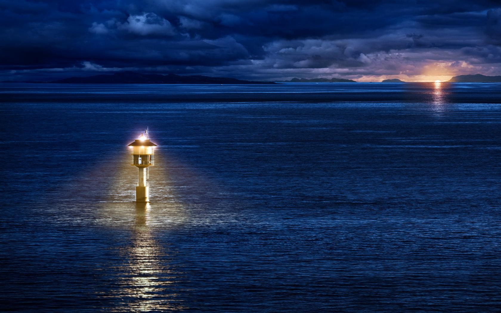 Lighthouse at dusk on the sea