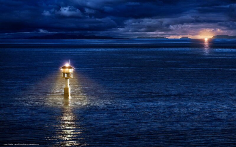 Lighthouse at dusk on the sea