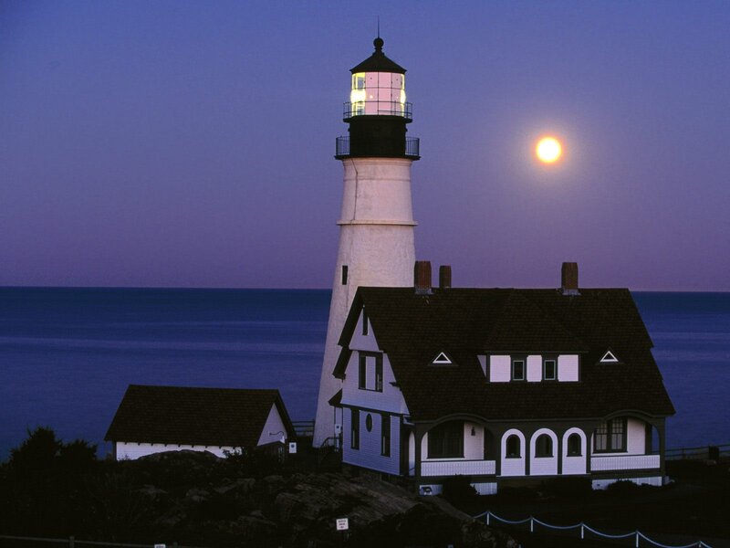 Lighthouse at dusk with full moon