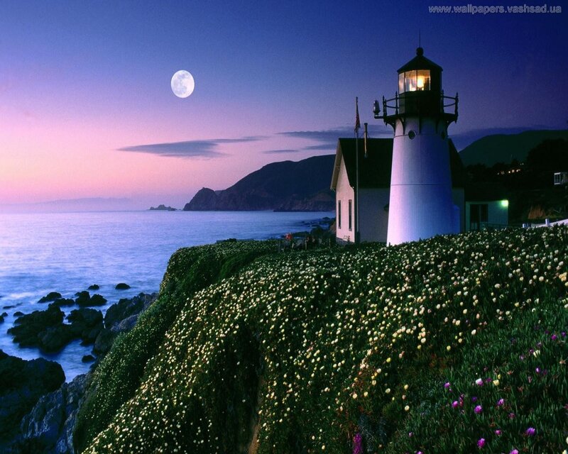 Lighthouse at dusk with full moon