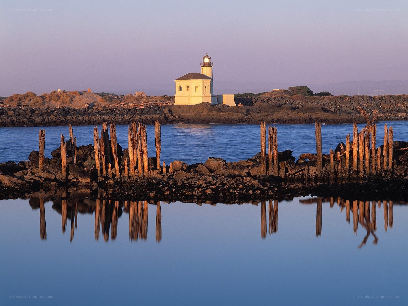 Lighthouse at dusk with reflections
