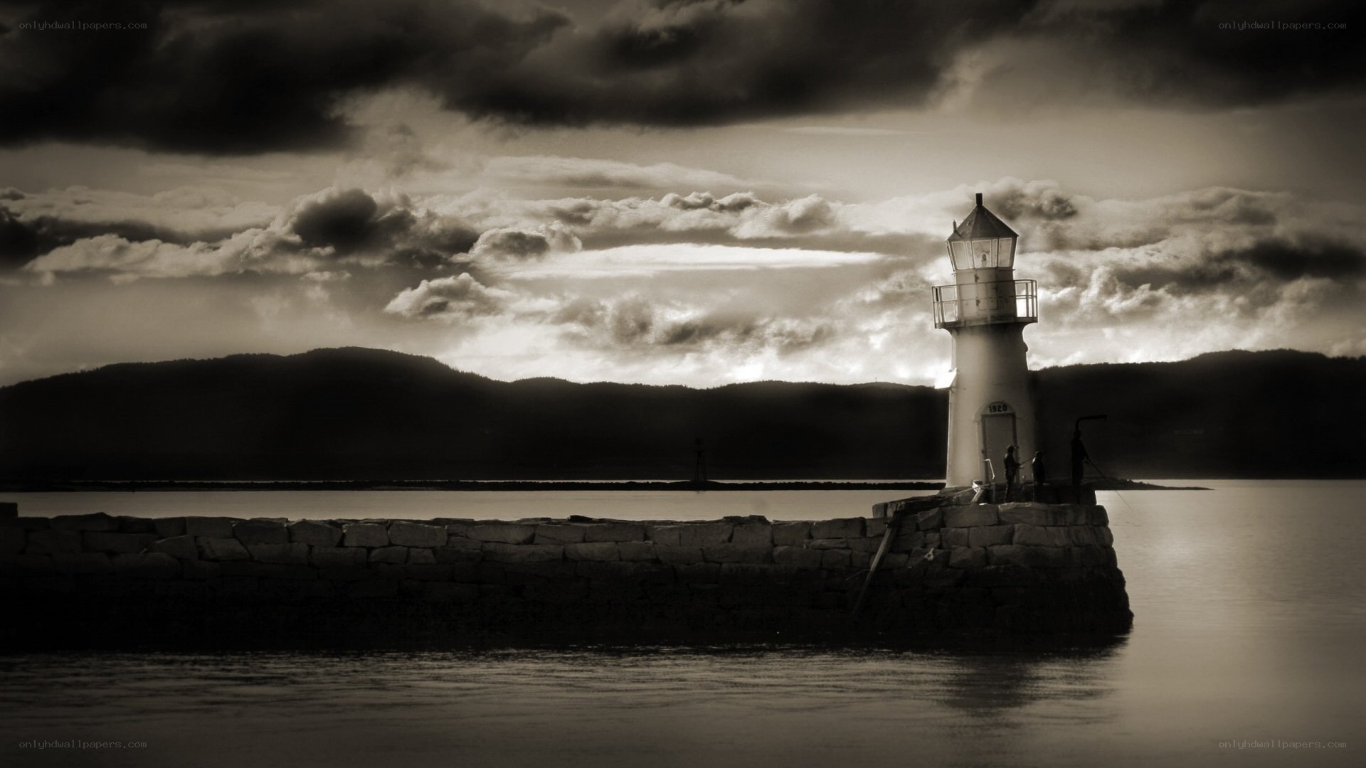 Lighthouse at dusk with stormy sky