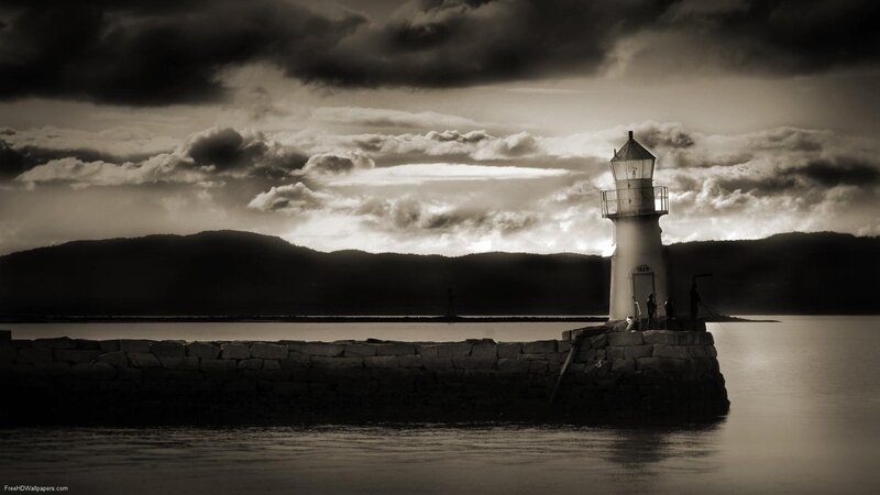 Lighthouse at dusk with stormy sky