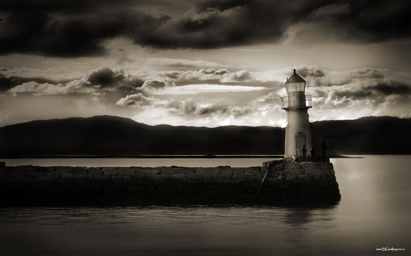 Lighthouse at dusk with stormy sky