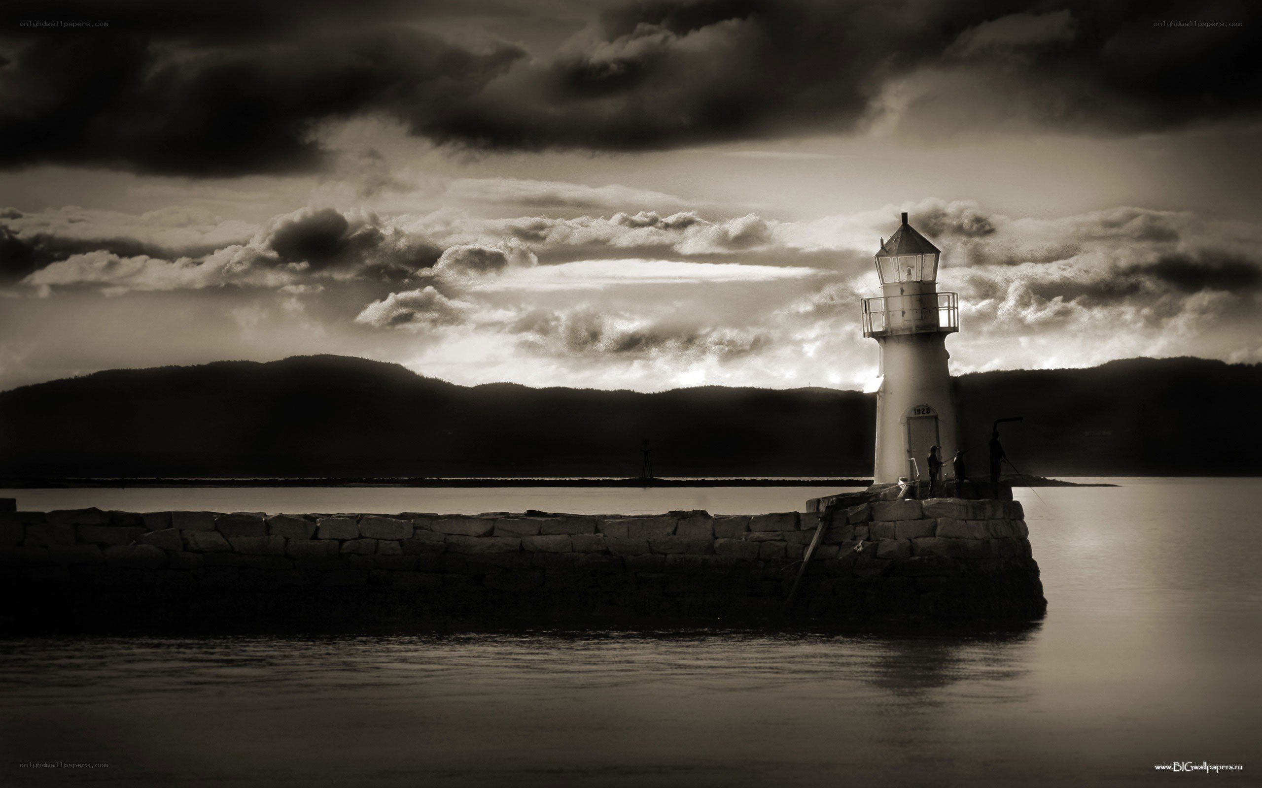 Lighthouse at dusk with stormy sky