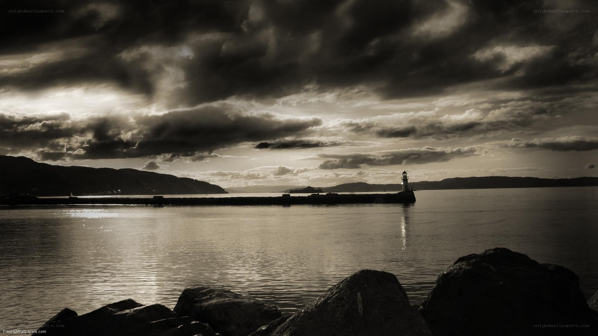 Lighthouse at dusk with stormy sky