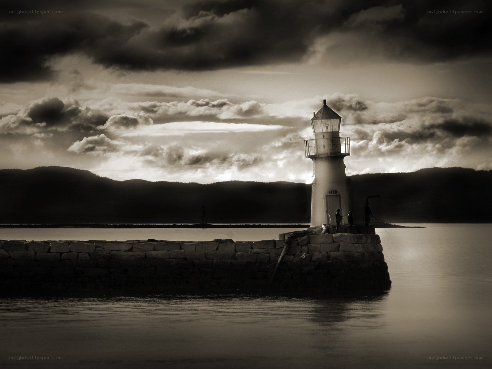 Lighthouse at dusk with stormy sky