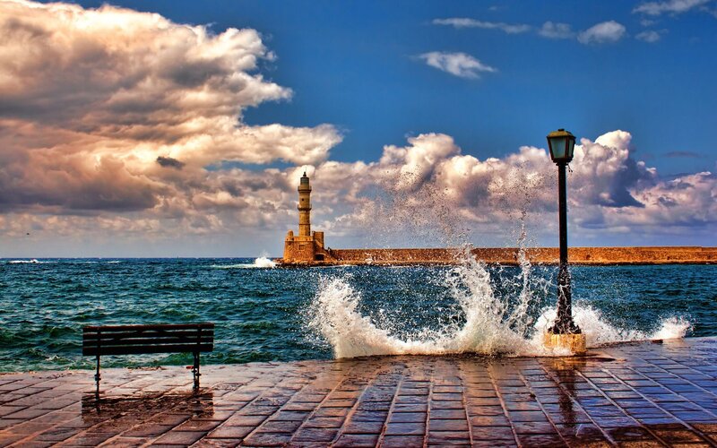 Lighthouse at Harbor Entrance — Blue, Dramatic, Afternoon, Photograph, Bench