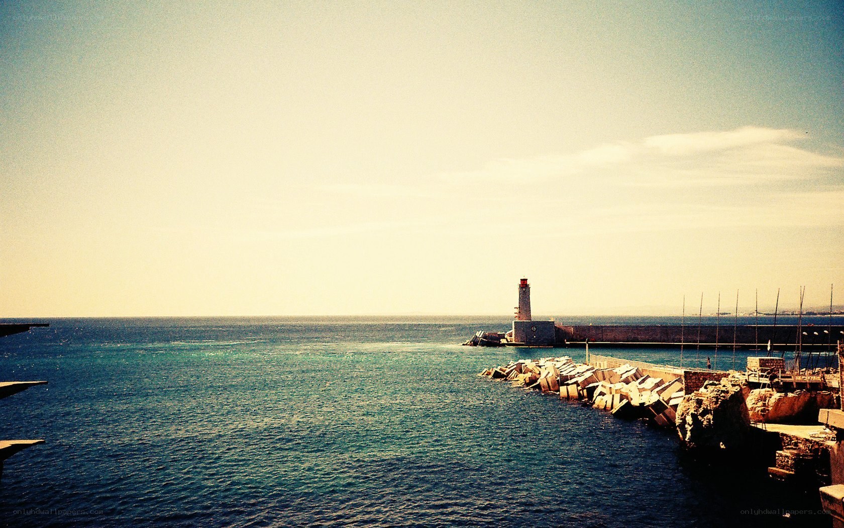 lighthouse at harbor entrance