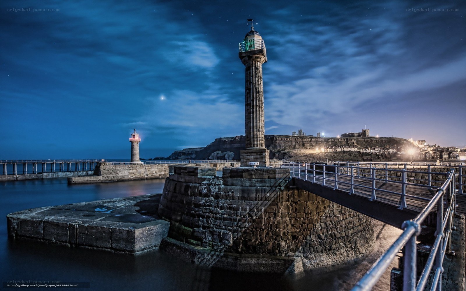 lighthouse at night in port